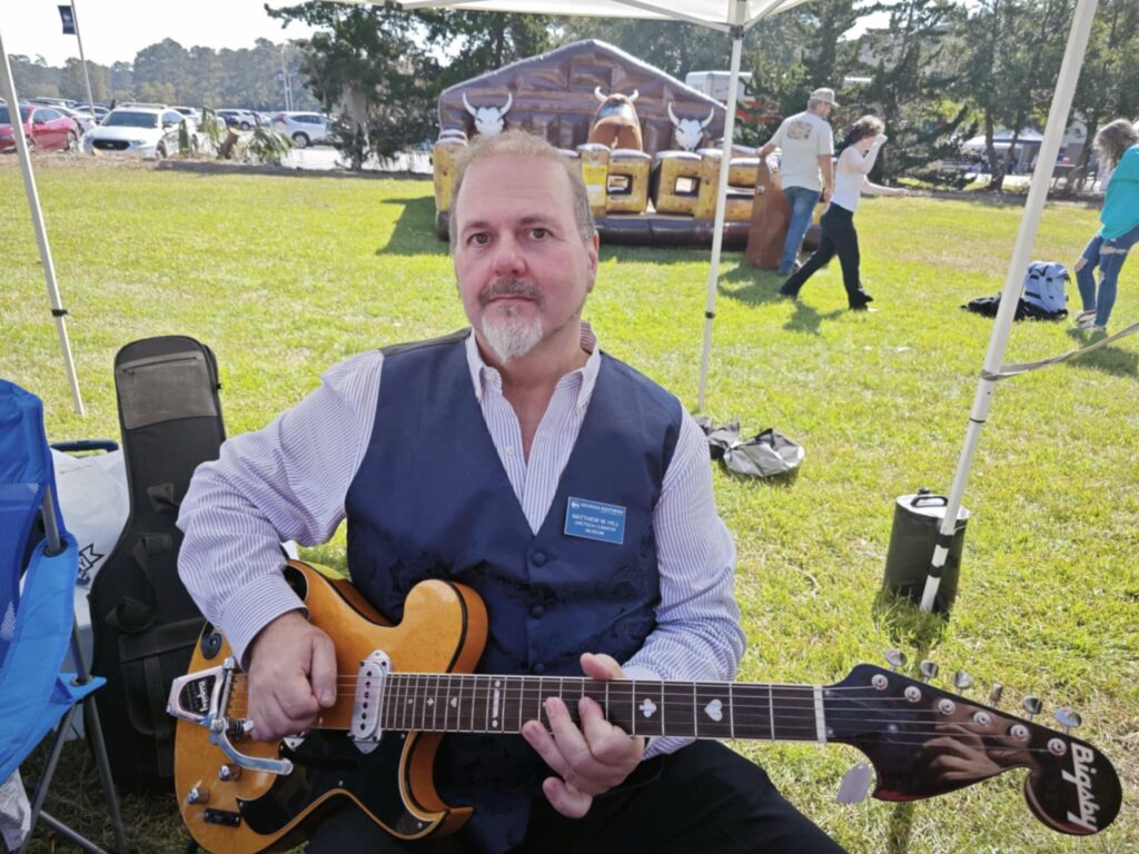 Matthew Hill plays guitar