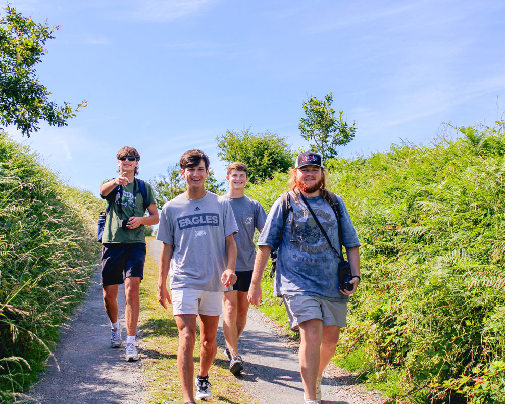 Group of Georgia Southern students having fun walking along a beautiful Ireland countryside trail.