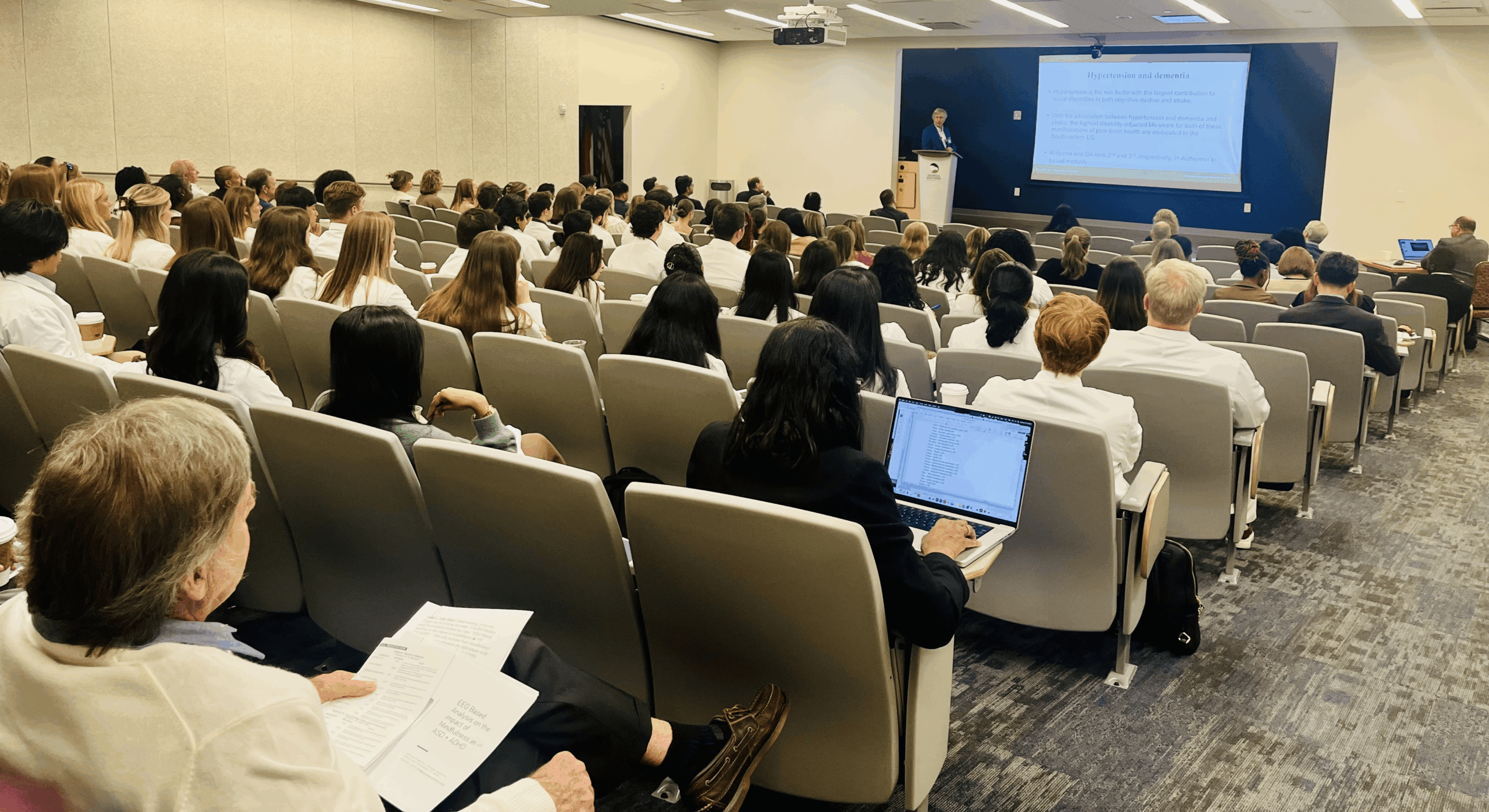 Students sit during a presentation at the Community Engaged Research Conference