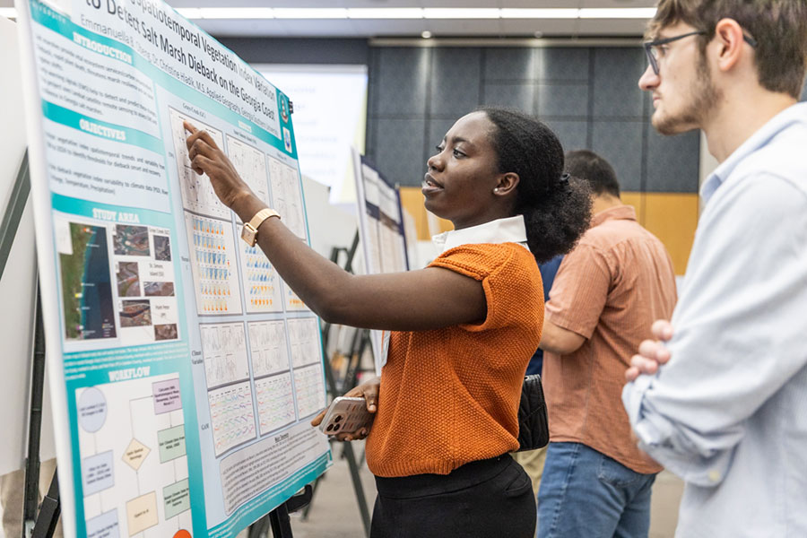 Women keenly addressing her work to listeners