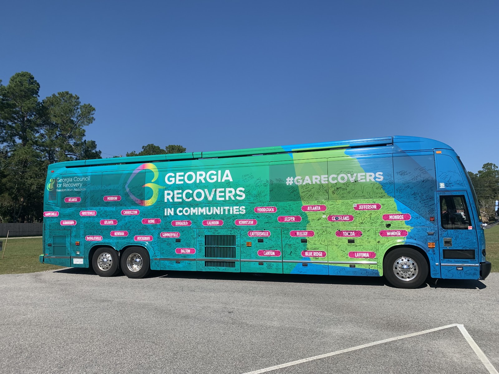 A large, colorful tour bus for 