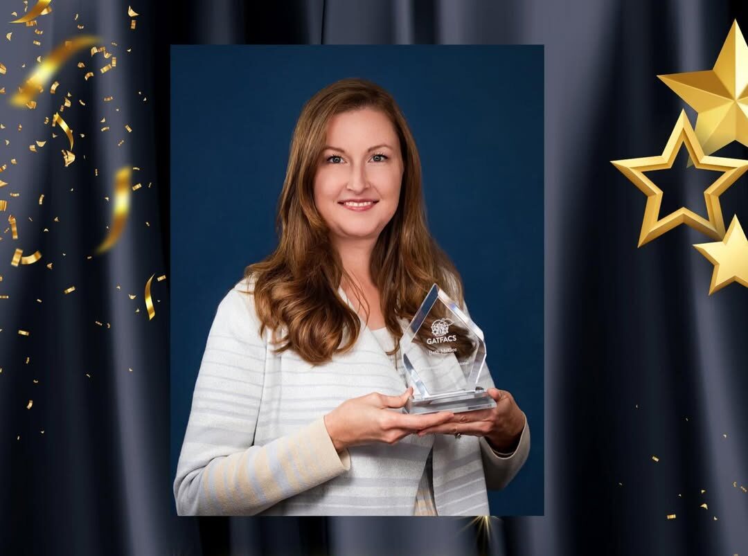 Dr. Beth McGee poses with award.