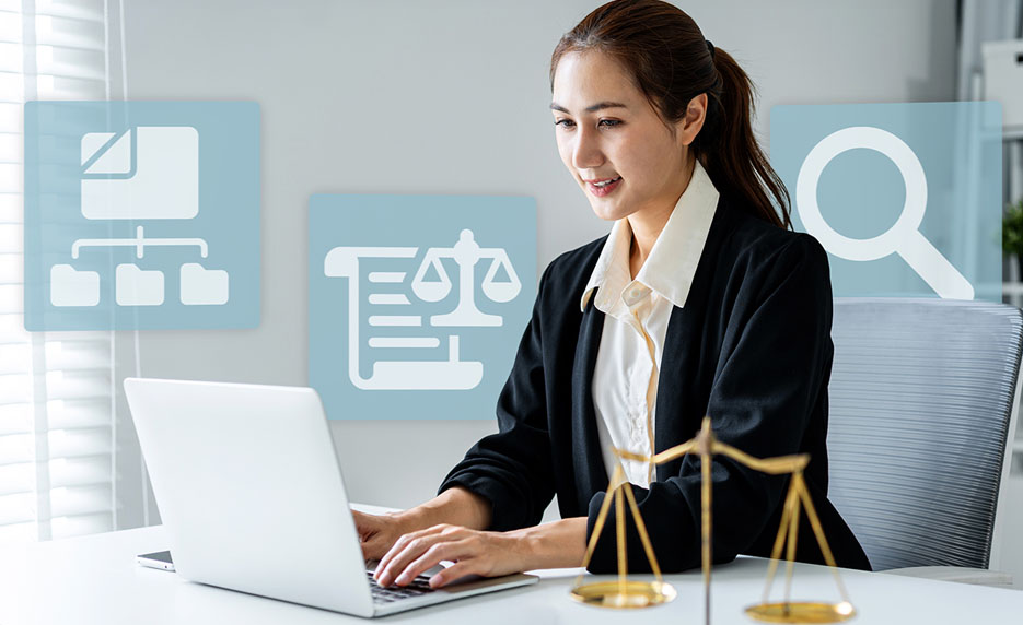 Legal professional working on a laptop at a desk with law-themed icons (scales, document, search) in the background.
